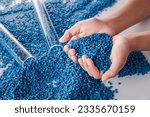 Small photo of White plastic grain, plastic polymer granules,hand hold Polymer pellets, Raw materials for making water pipes, Plastics from petrochemicals and compound extrusion, resin from plant polyethylene.