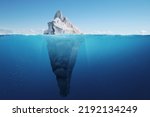 Amazing iceberg with a hidden iceberg underwater in the ocean. The tip of the iceberg, a concept. Creative idea of a hidden danger. Global warming and melting glaciers 