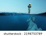 Small photo of Statue of Liberty Underwater. Catastrophe and global warming, concept. Flooding of America. Creative idea of environmental pollution
