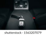 Car ignition key at the armrest