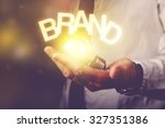Brand idea concept with businessman holding light bulb, retro toned image, selective focus.