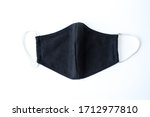 a black cloth mask in a white... | Shutterstock . vector #1712977810