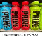 Small photo of Prague, Czech Republic - January 9, 2024: Blue, red and green plastic bottles of Prime, the energy drink infamous for its extremely high caffeine content and advertising aimed at children. High