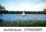 A White Sailboat On A Lake On A ...