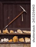 Small photo of A collection of stones and a pickaxe