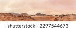 Small photo of Red orange Mars like landscape in Jordan Wadi Rum desert, mountains background overcast morning, wide panorama. This location was used as set for many science fiction movies