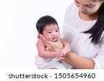 Small photo of Beautiful young Asian mother hold tiny adorable newborn baby girl 0-1 month with her hand to help baby belch or Making burp after feeding with caring and love, lifestyle health care newborn at home