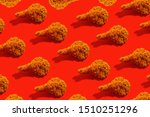 Fried chicken leg on a red background. Food pattern