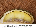 Small photo of Ripe durian (Monthong Uttaradit) with halves is placed on woven bamboo table. It has unique aroma, creamy, juicy, sweet, soft, yellow flesh. It's healthy popular fruit. Uttaradit, Thailand.