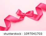 pink ribbon with bow on color... | Shutterstock . vector #1097041703