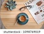 Creative flat lay composition with delicious hot coffee on table