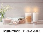 Beautiful composition with burning wax candles on table