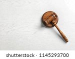 Judge's gavel on light background, top view. Law concept