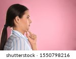 Young woman with double chin on pink background. Space for text