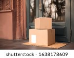 Delivered parcels on door mat near entrance