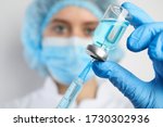Doctor filling syringe with medication, closeup. Vaccination and immunization