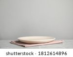 empty plate and pink towel on... | Shutterstock . vector #1812614896