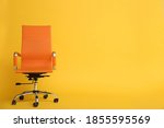 Modern office chair on yellow...
