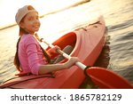 Happy Girl Kayaking On River At ...