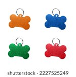 Small photo of Set with multicolor bone shaped dog tags on white background