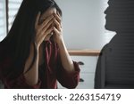 Suffering from hallucination. Scared woman having panic attack because of man's shadow