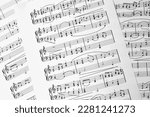 Music sheets. Melodies written with different musical symbols as background, closeup