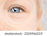Hypnosis and therapy. Swirl over little child's face, closeup. Collage design