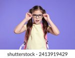 Cute schoolgirl in glasses with ...