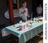 Small photo of VICTORIA, B.C., CANADA - A young docent gives a demonstration of how families used Campbell Soup when baking during World War II at the Fort Rodd National Historic Site.