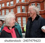 Small photo of LondonUK - June 20 2014: John Pilger Outside Ecuadorian Embassy with Susan Benn wife of the late Gavin Macfayden, supporting the protest against extradition of Julian Assange Vigil.