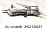 Small photo of 4 February 2024, Istanbul, Turkiye: Mini figures and plane from Lego set called Pirate Snub Fighter, numbered 75346, photographed indoors.
