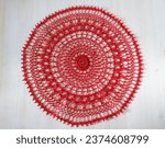 Red crochet doily. This photo has been taken in Prague, 2023