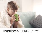 Cute Little Boy With Cup Of Hot ...