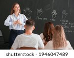 Small photo of Teacher conducting courses for deaf mute people in classroom