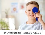 Small photo of Little boy undergoing eye test in clinic