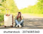 Upset Young Woman With Suitcase ...
