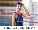 Sporty Female Swimmer In Pool