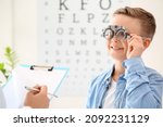 Small photo of Little boy undergoing eye test in clinic