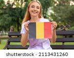 Mature woman with flag of...