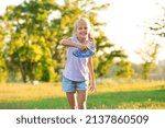 Small photo of Cute little children playing frisbee outdoors