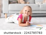 Cute little girl drawing with...