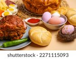 Tasty dishes and painted eggs for Easter dinner on color background, closeup