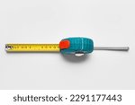 Measuring tape on grey background