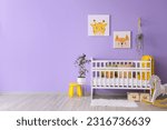 Small photo of Stylish interior of children's room with baby bed and rocking horse