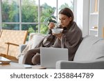 Ill young woman eating chicken soup at home