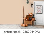 Interior of hall decorated for Halloween with door and pumpkins