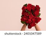 Female hands with bouquet of...