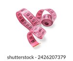 Pink measuring tape on white...