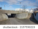 Small photo of Reykjavik, Iceland, April 21, 2022: gracious curves of brute concrete at a pedestrian underpass