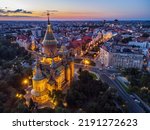 Aerial photo from a flight over the Timisoara Orthodox Cathedral and the illuminated city center.  Photo taken on 10th of August 2022, in Timisoara, Timis county, Romania.